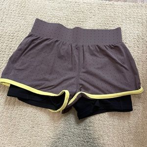 Fabletics shorts with spandex inside. Purple grey color. Size medium.
